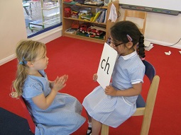 2 girls learning letters
